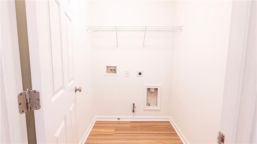 2070 Hailston Drive Northwest Duluth, GA 30097 - Photo 33 of 42 a bathroom with a sink and a mirror