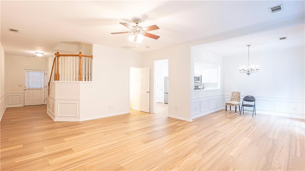 2070 Hailston Drive Northwest Duluth, GA 30097 - Photo 7 of 42 a view of empty room with wooden floor and fan