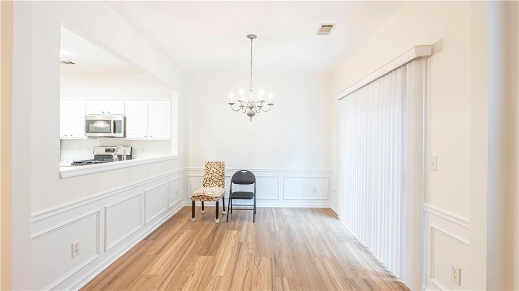 2070 Hailston Drive Northwest Duluth, GA 30097 - Photo 8 of 42 a bathroom with a sink a mirror and a shower