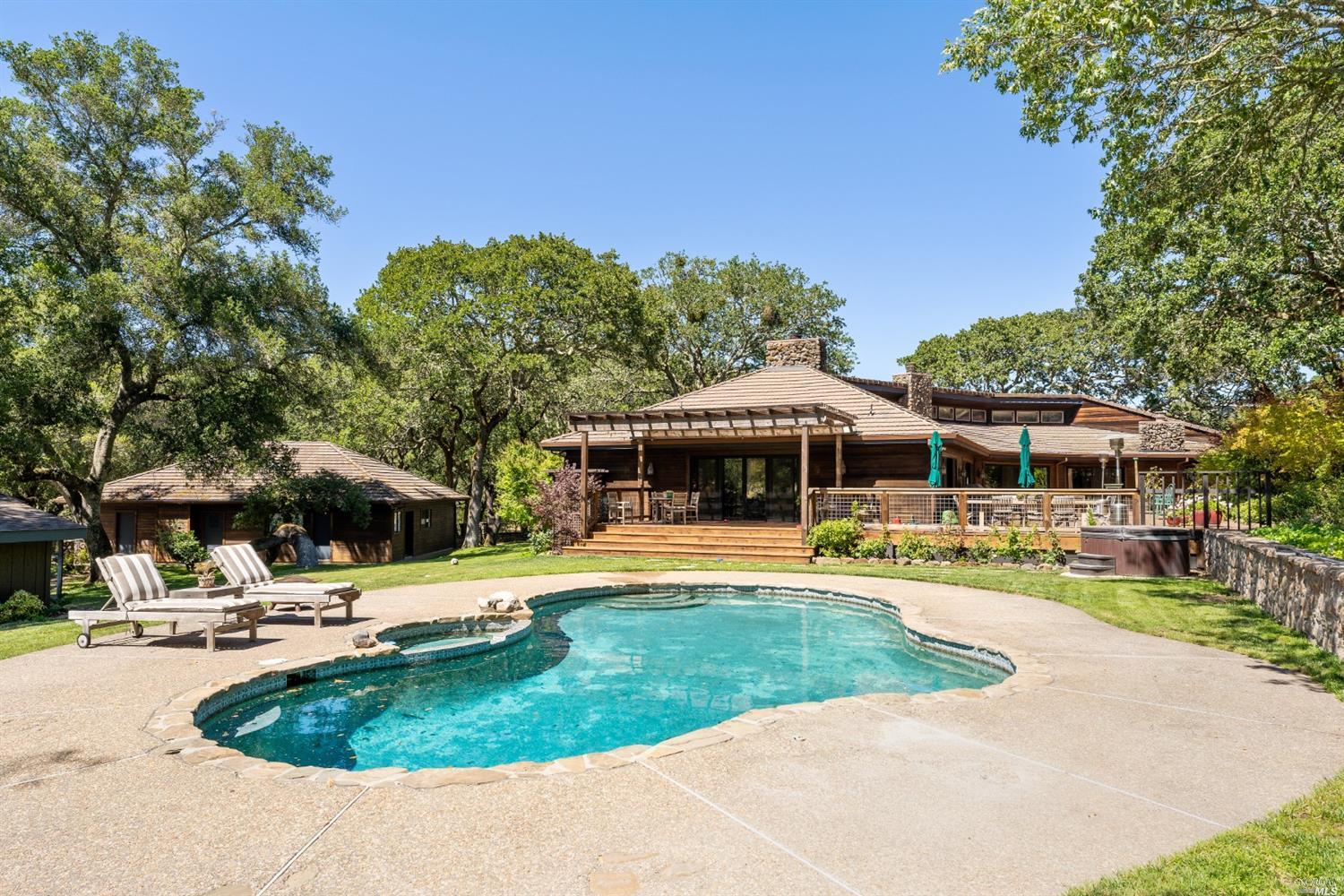 8742 Summerhill Lane Glen Ellen, CA 95442 - Photo 1 of 1 a view of a swimming pool with a patio