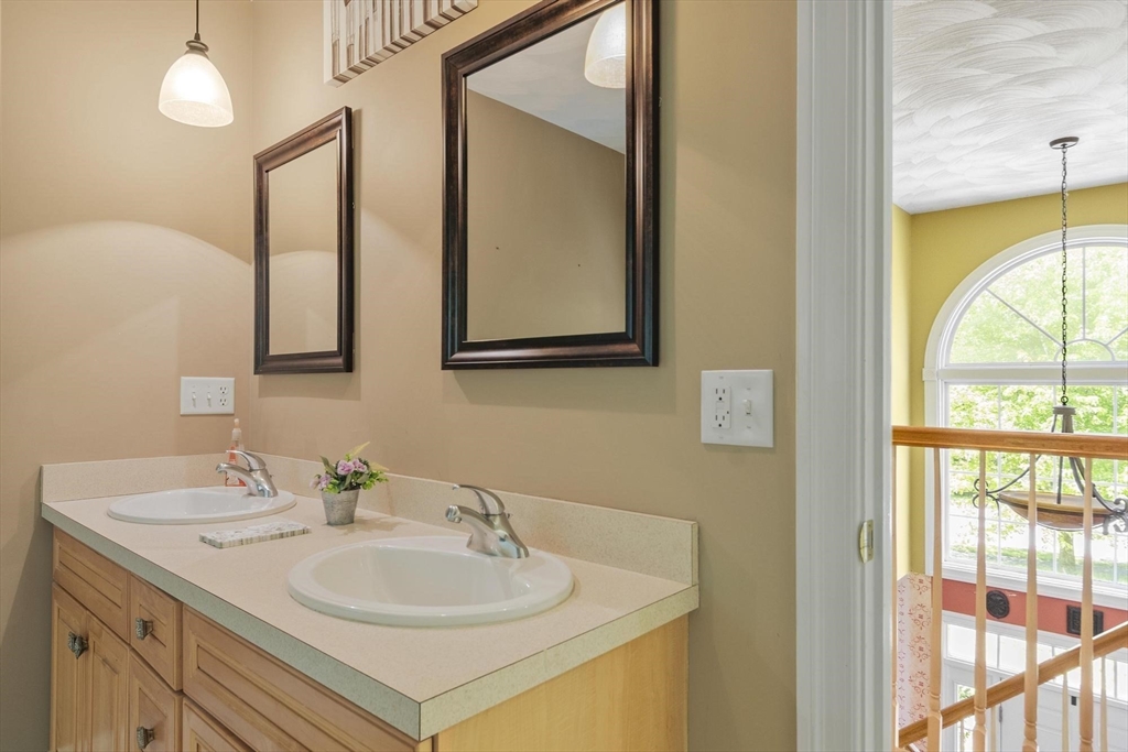 4 Forest Street Georgetown, MA 01833 - Photo 29 of 37 a bathroom with a sink and a mirror