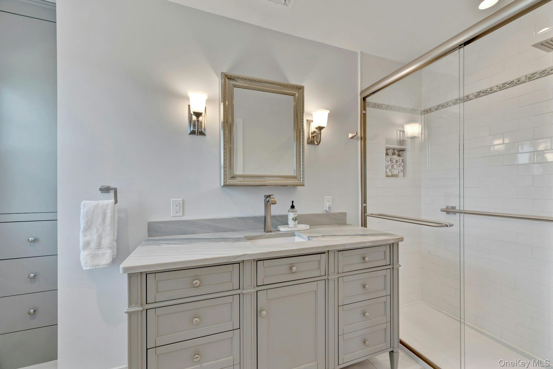 110 Sleepy Hollow Lane Southold, NY 11971 - Photo 19 of 46 Bathroom with vanity and a shower stall
