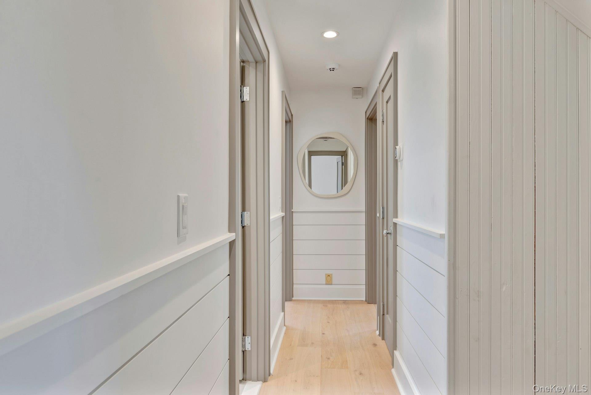 110 Sleepy Hollow Lane Southold, NY 11971 - Photo 20 of 46 Corridor featuring recessed lighting and light wood-style flooring