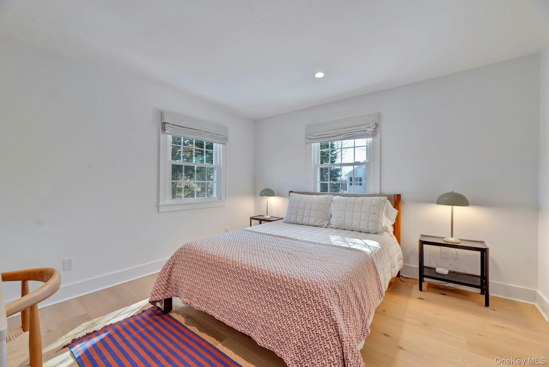 110 Sleepy Hollow Lane Southold, NY 11971 - Photo 21 of 46 Bedroom with wood finished floors and recessed lighting