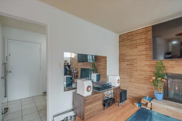 a work room with furniture and wooden floor