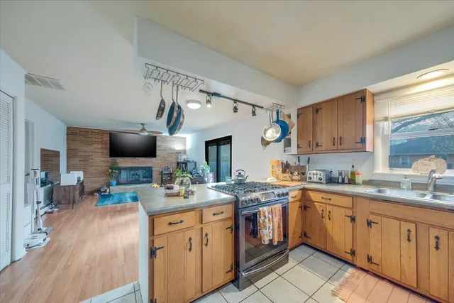 a kitchen with a sink stove and cabinets