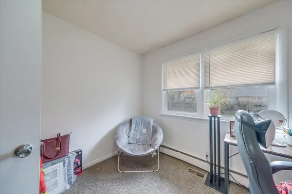 a room with furniture and a window