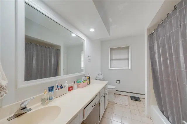 a bathroom with a sink vanity and a mirror