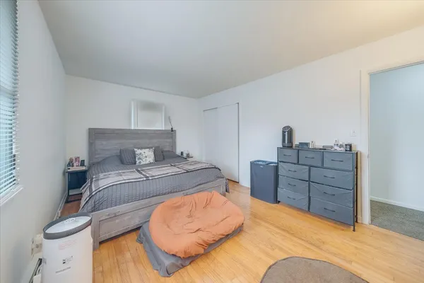 a bedroom with a bed and cabinets
