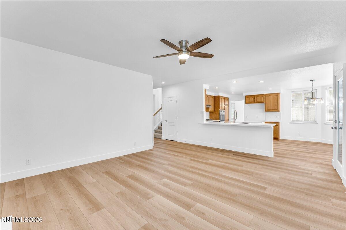 2329 Red Maple Court Reno, NV 89523 - Photo 16 of 39 a view of a big room with wooden floor and windows