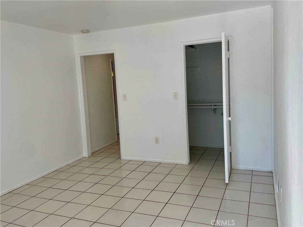 1000 West MacArthur Boulevard, Unit 87 Santa Ana, CA 92707 - Photo 13 of 36 an empty room with white walls