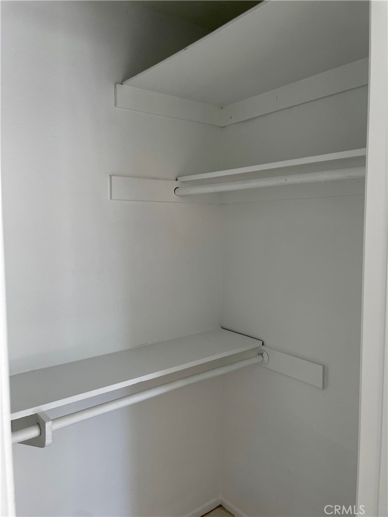 1000 West MacArthur Boulevard, Unit 87 Santa Ana, CA 92707 - Photo 14 of 36 a view of a room with racks on the wall