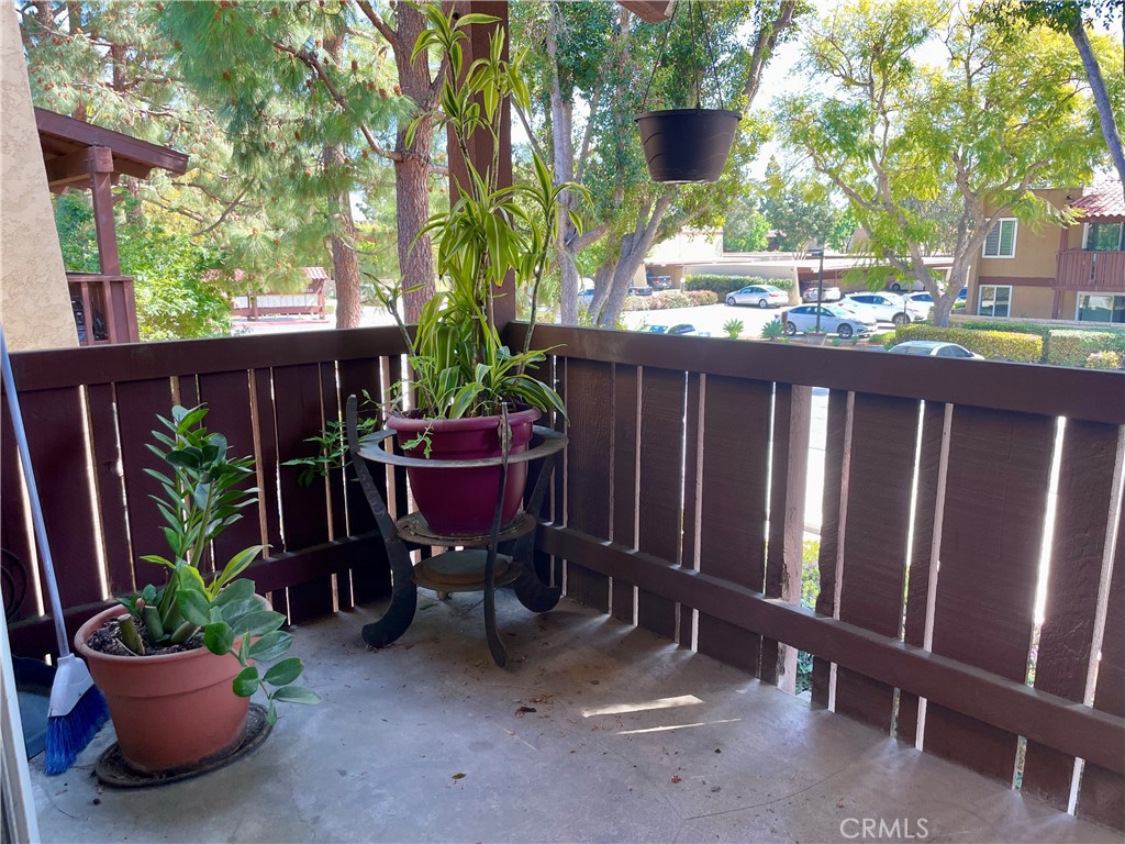 1000 West MacArthur Boulevard, Unit 87 Santa Ana, CA 92707 - Photo 18 of 36 a view of a wooden bench with chairs in patio