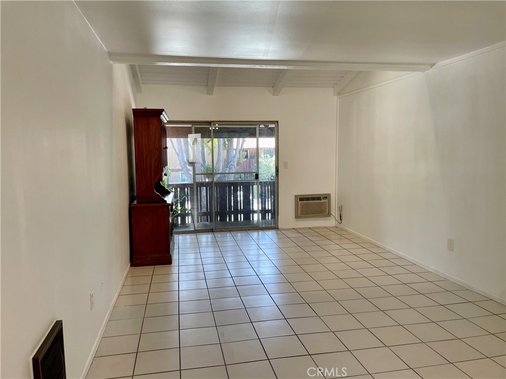 1000 West MacArthur Boulevard, Unit 87 Santa Ana, CA 92707 - Photo 3 of 36 a view of empty room with wooden floor