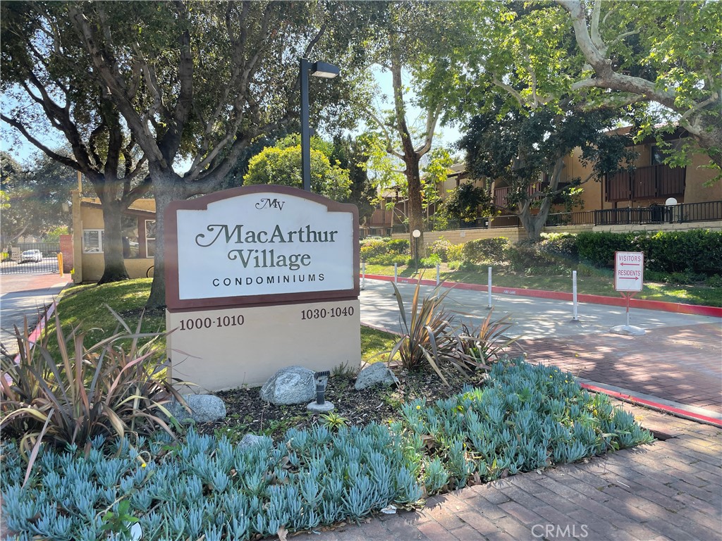 1000 West MacArthur Boulevard, Unit 87 Santa Ana, CA 92707 - Photo 35 of 36 a sign that is on a brick wall