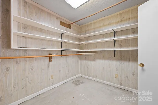 a view of an empty walk in closet