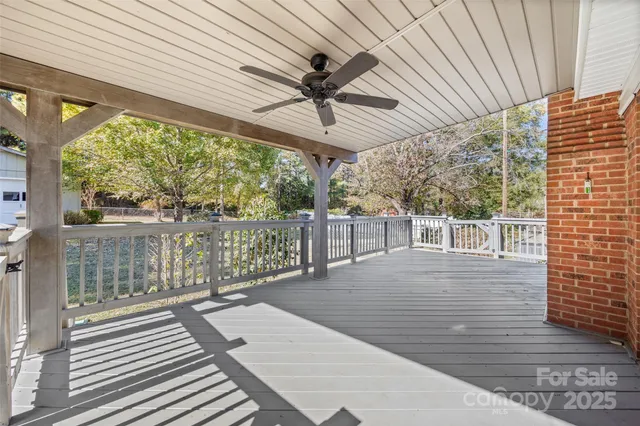 a view of a balcony with wooden floor