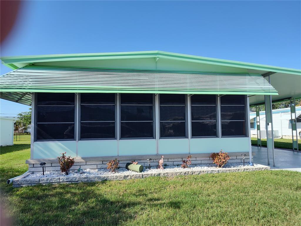 4715 Burney Drive Holiday, FL 34690 - Photo 1 of 1 a front view of house with yard