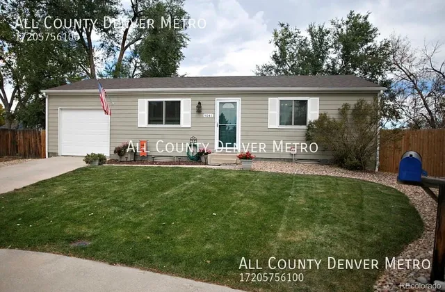 a front view of house with yard and outdoor seating