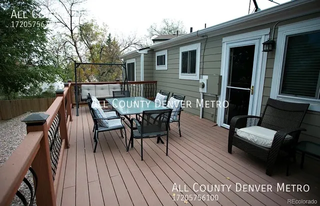 a view of a house with a yard and sitting area