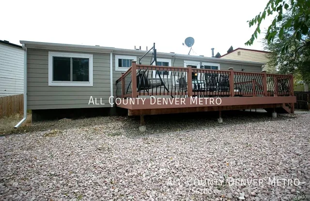 a view of a balcony with two chairs