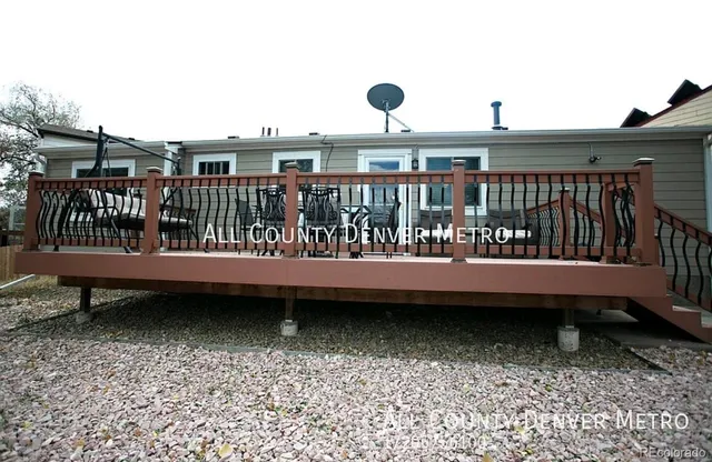 a view of a chairs and table on the deck