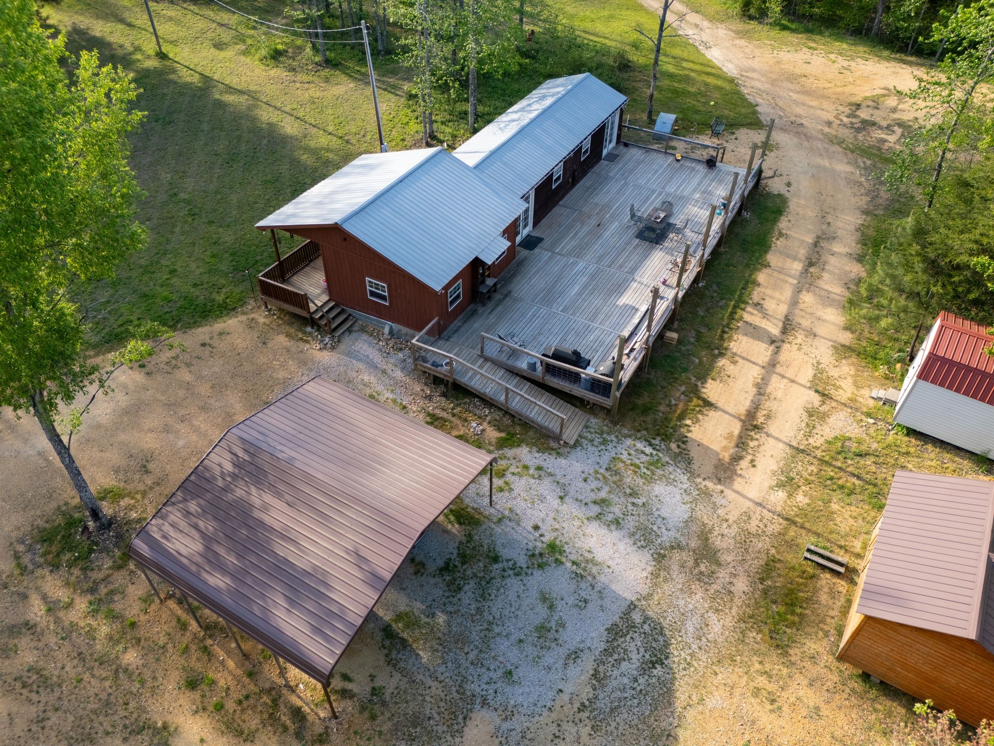 664 Russ Valley Road Lobelville, TN 37097 - Photo 5 of 63 an aerial view of a house with a yard