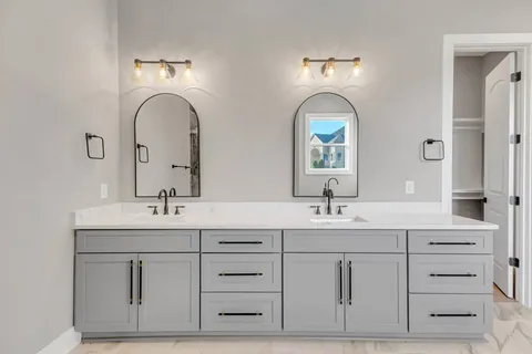 a view of an empty room with a kitchen