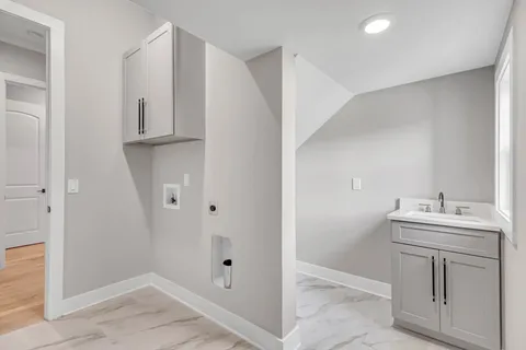 a view of a house with a yard and a garage