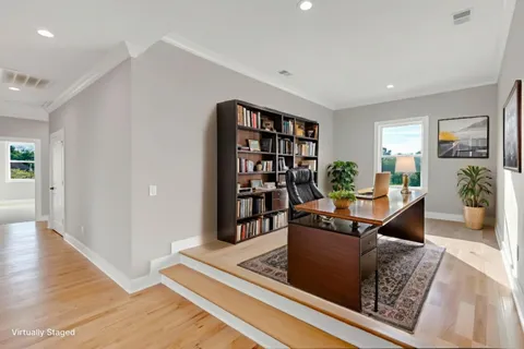 an aerial view of a house with a swimming pool