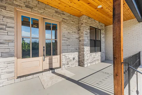 a view of a brick house with an outdoor space