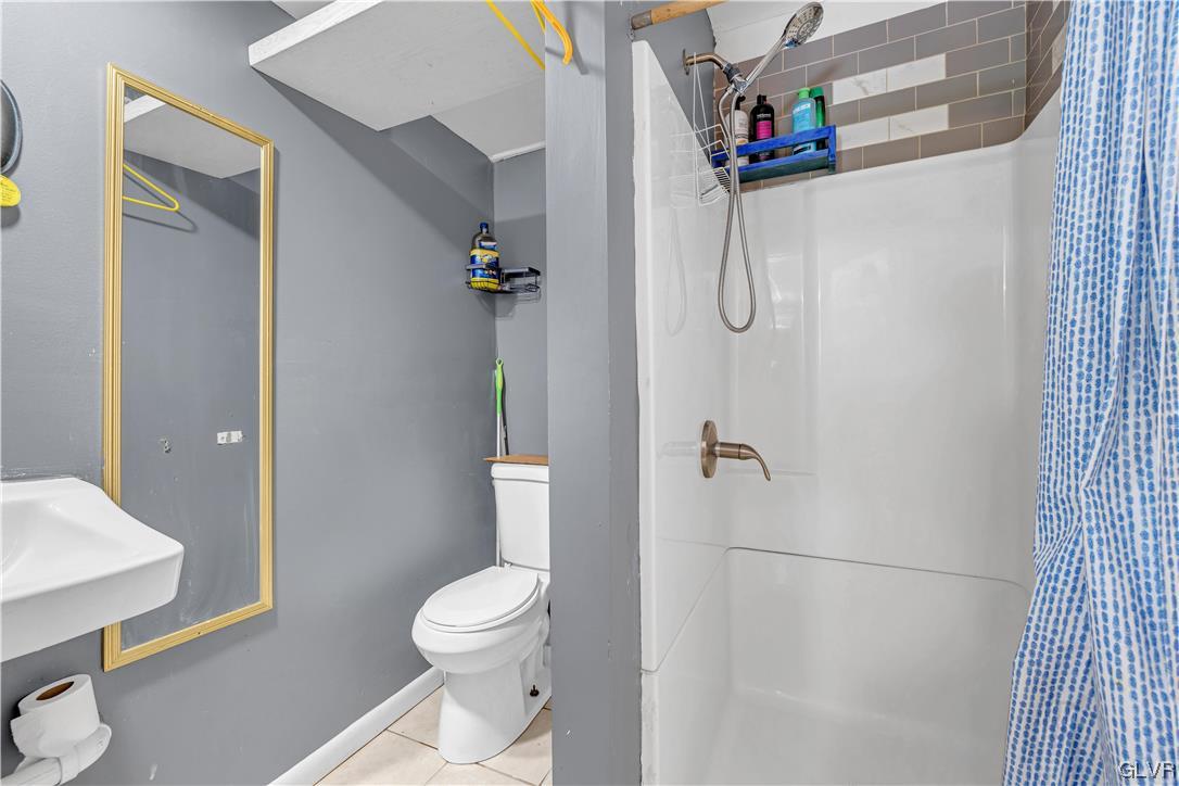 Undisclosed Address Saylorsburg, PA 18353 - Photo 13 of 18 a bathroom with a granite countertop shower and a toilet