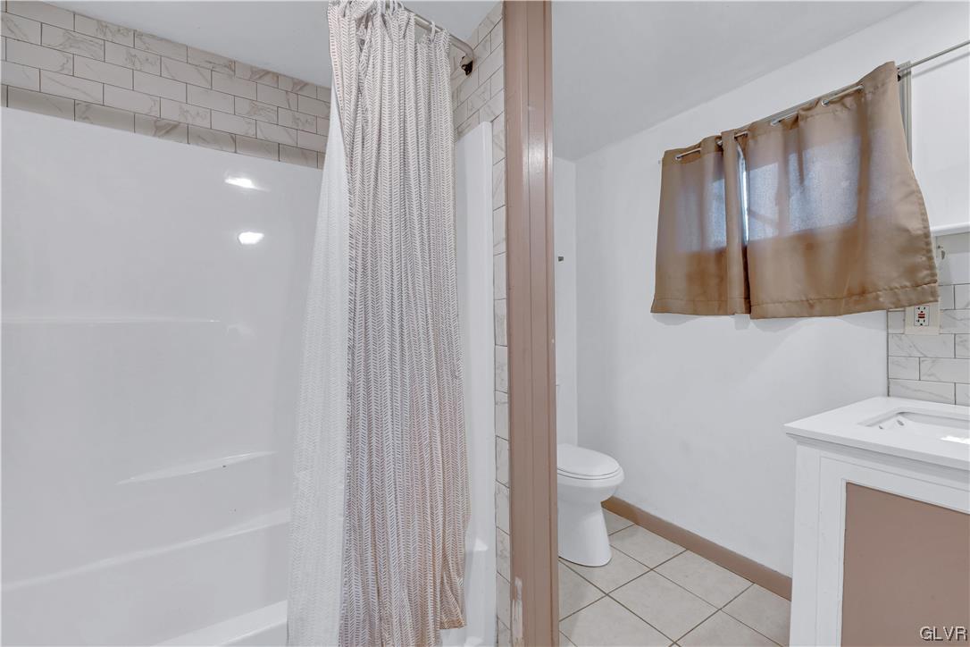 Undisclosed Address Saylorsburg, PA 18353 - Photo 18 of 18 a bathroom with a shower toilet and sink