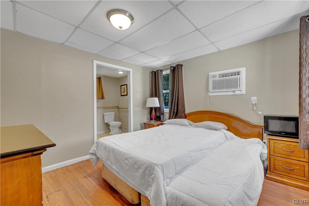 Undisclosed Address Saylorsburg, PA 18353 - Photo 9 of 18 a bedroom with a bed and a lamp on dresser