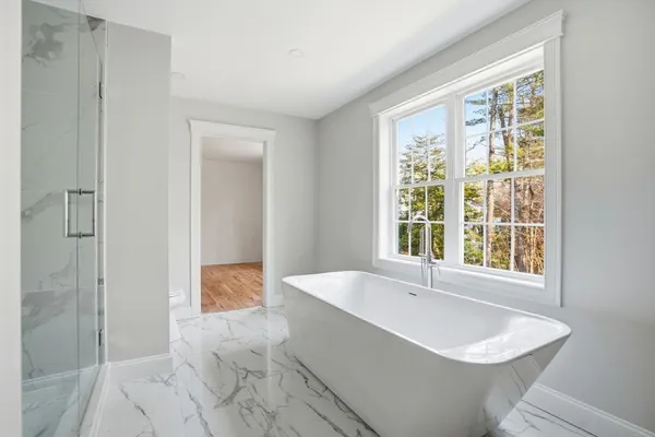 a bathroom with a bathtub and a sink