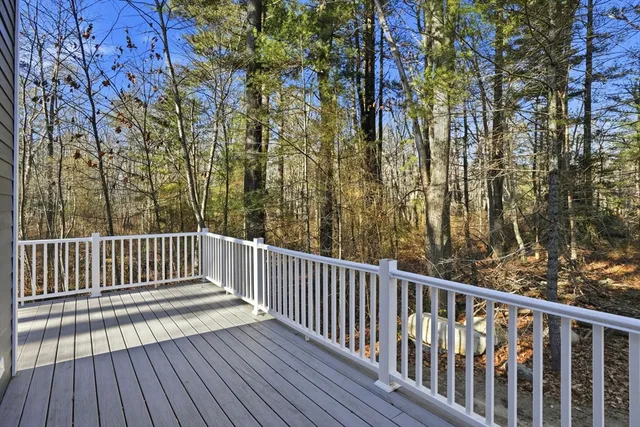 a view of deck with wooden floor and fence
