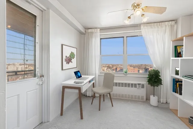 a view of an empty room with a window