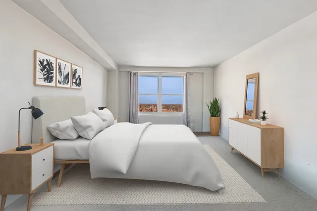 a kitchen with white cabinets and appliances