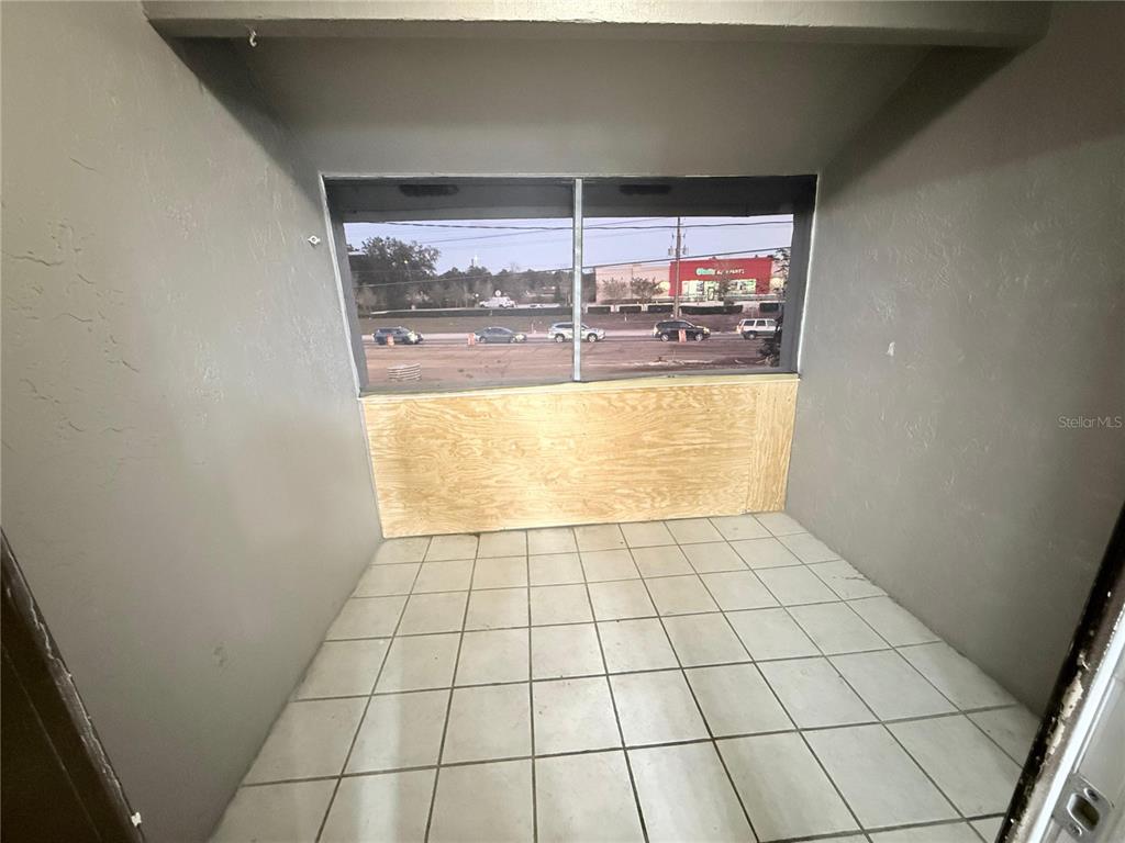 108 Booth Lane, Unit A Kissimmee, FL 34743 - Photo 19 of 19 a view of an empty room and window