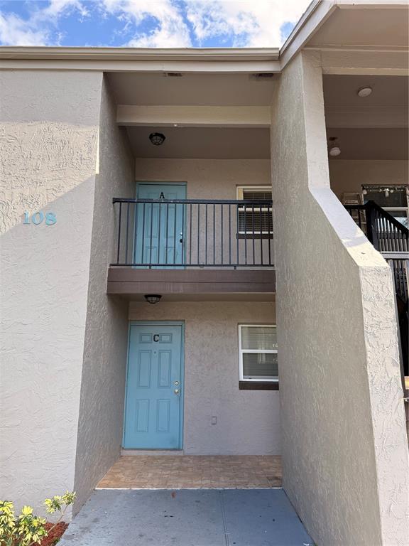 108 Booth Lane, Unit A Kissimmee, FL 34743 - Photo 3 of 19 a view of staircase with wooden floor