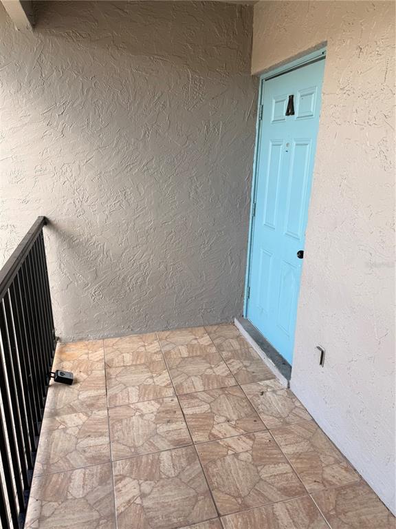 108 Booth Lane, Unit A Kissimmee, FL 34743 - Photo 4 of 19 a view of wooden door