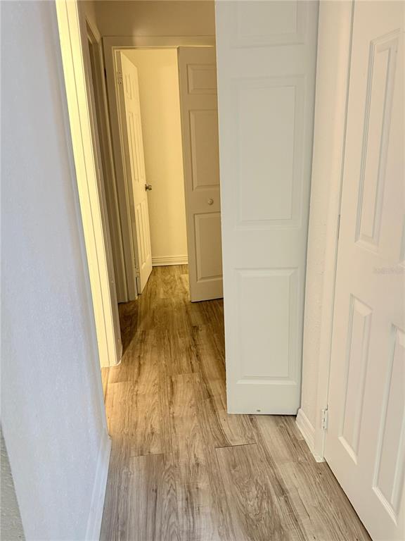 108 Booth Lane, Unit A Kissimmee, FL 34743 - Photo 9 of 19 an entryway of a house with wooden floor