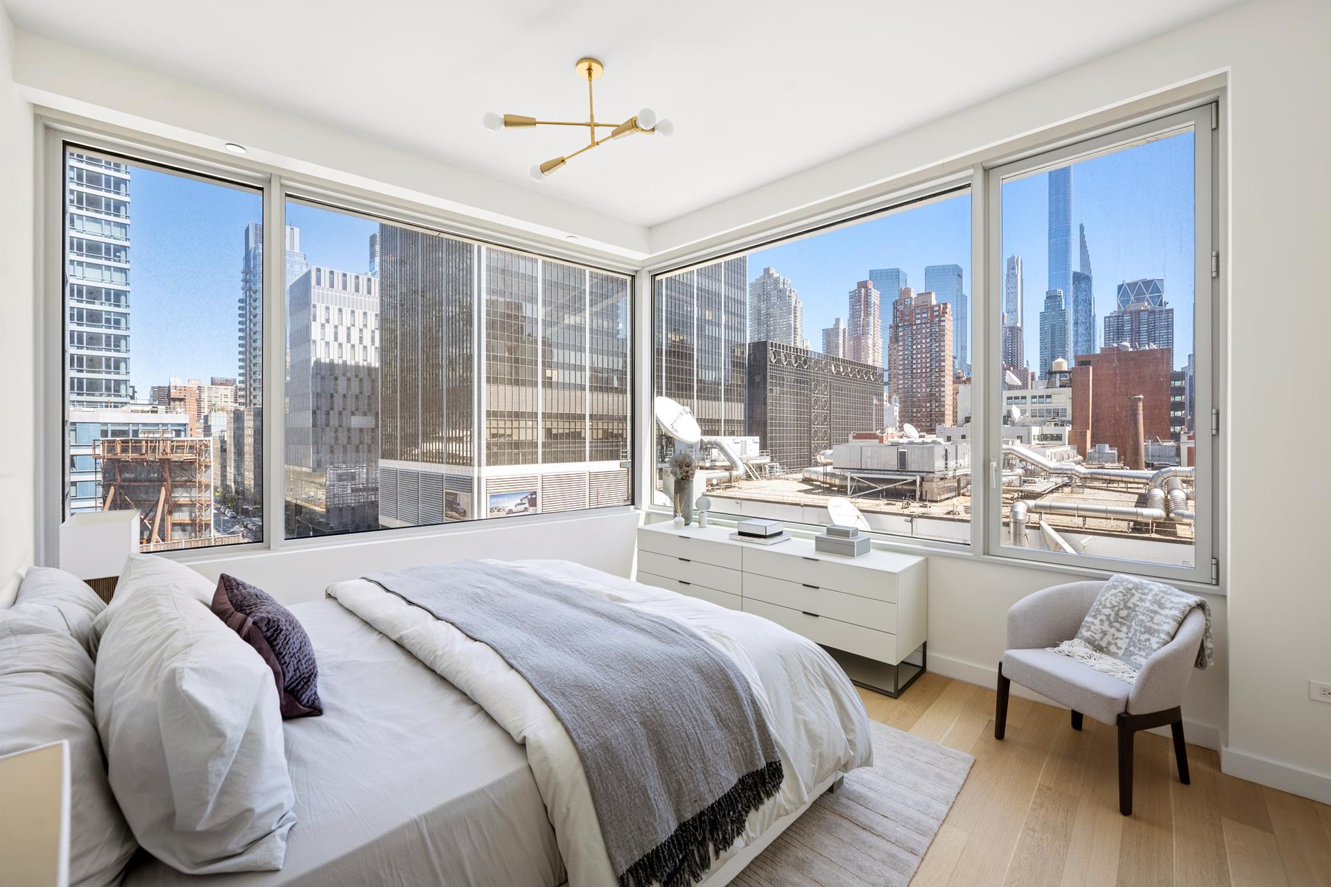 611 West 56th Street, Unit MAIS-ONWEST Manhattan, NY 10019 - Photo 26 of 38 a bed room with a bed and a large window