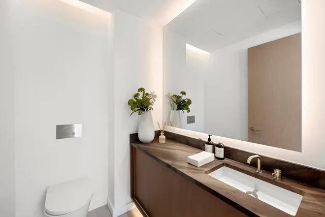 a bathroom with a toilet a sink and bathtub