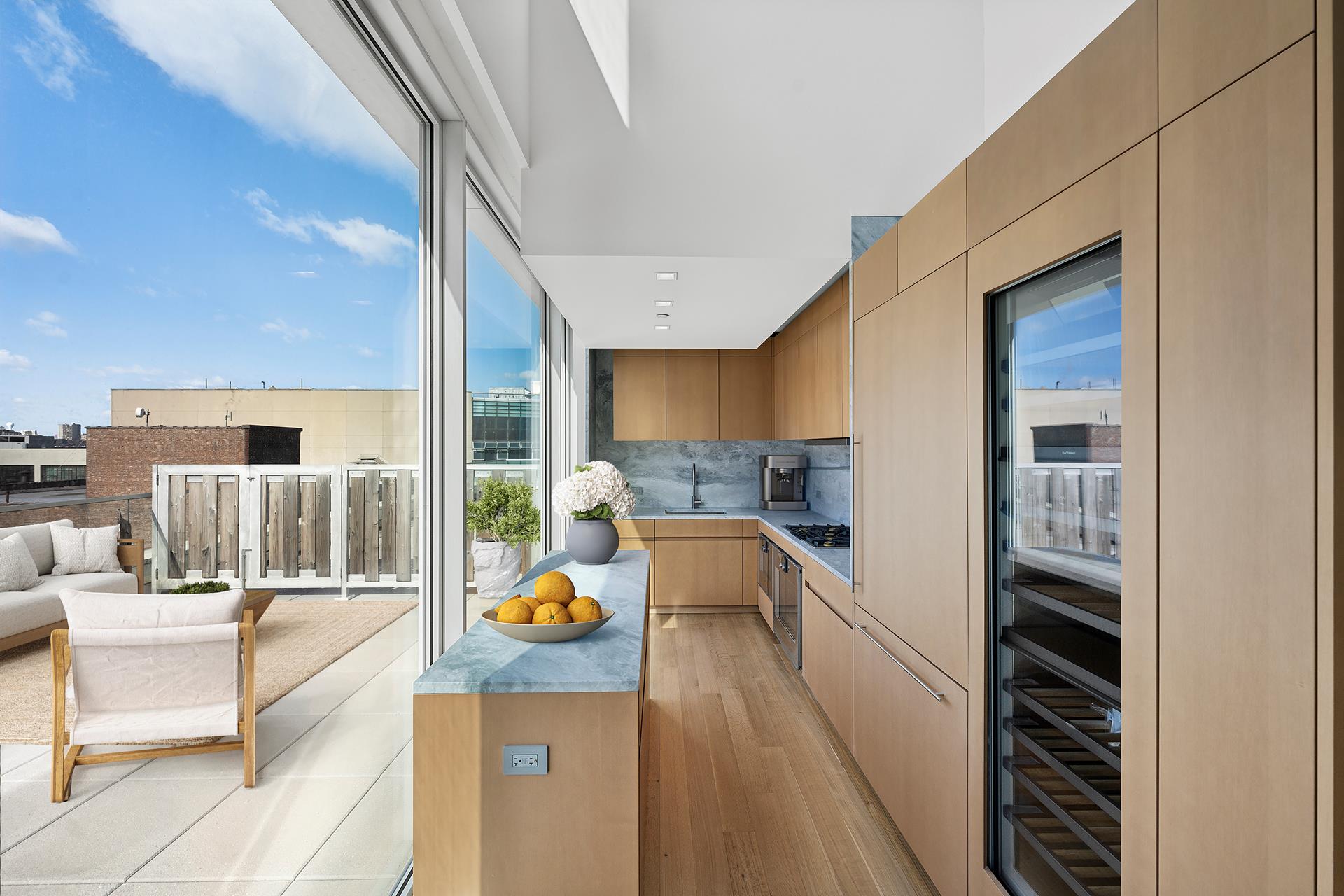 611 West 56th Street, Unit MAIS-ONWEST Manhattan, NY 10019 - Photo 5 of 38 a kitchen with a sink and counter top space
