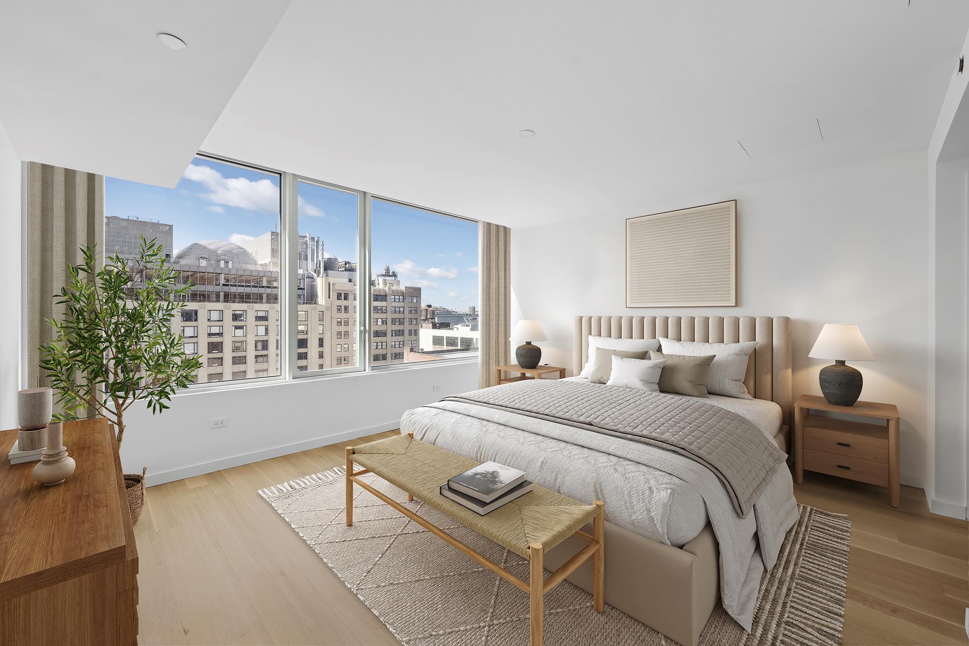 611 West 56th Street, Unit MAIS-ONWEST Manhattan, NY 10019 - Photo 6 of 38 a bedroom with a bed and a large window