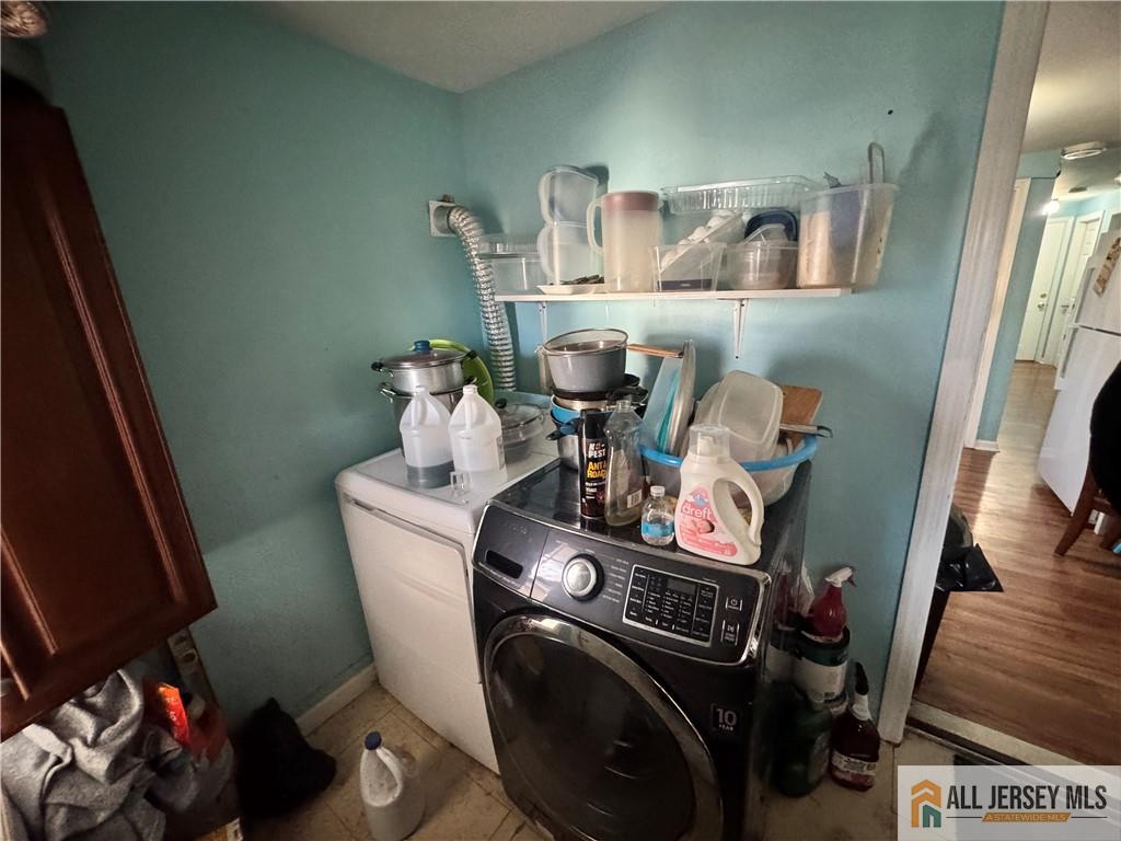 111 Delavan Street New Brunswick, NJ 08901 - Photo 14 of 28 a utility room with sink dryer and washer