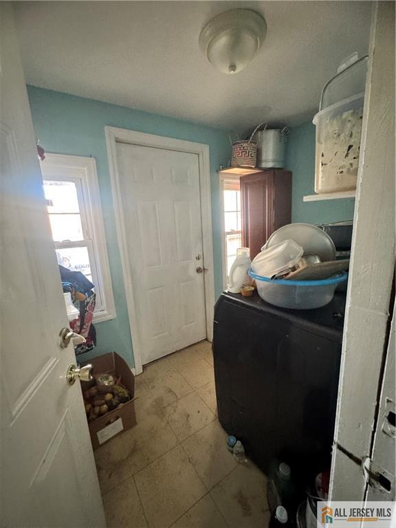 111 Delavan Street New Brunswick, NJ 08901 - Photo 15 of 28 a living room with furniture and a mirror