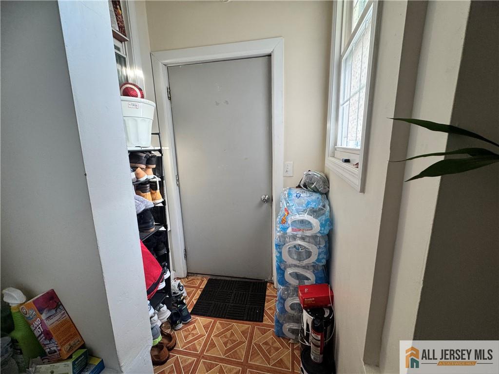 111 Delavan Street New Brunswick, NJ 08901 - Photo 19 of 28 a room with lots of stuff and hardwood floor