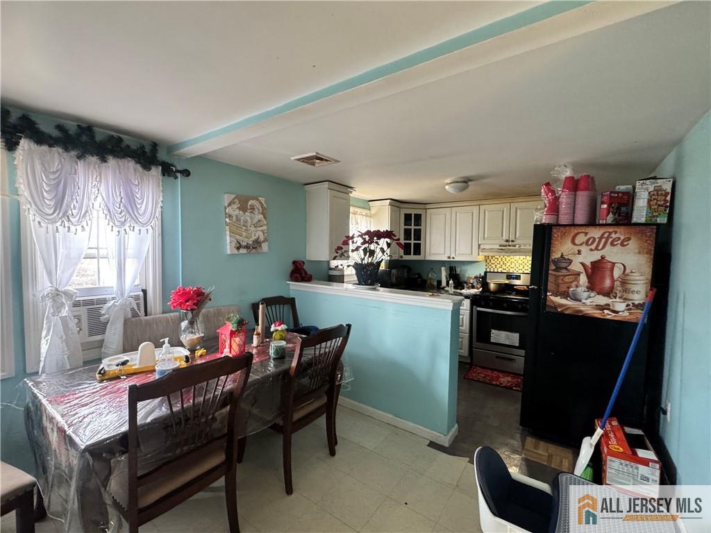 111 Delavan Street New Brunswick, NJ 08901 - Photo 21 of 28 a living room with furniture and a flat screen tv